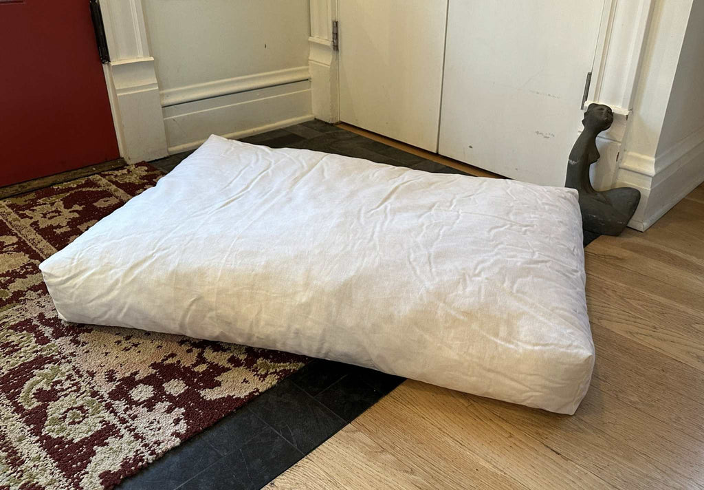 Heavy-duty cotton duck dog bed with CertiPUR foam fill and washable zippered cover