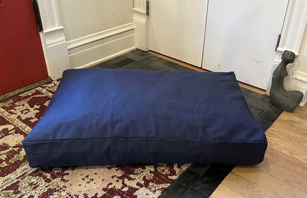 Heavy-duty cotton duck dog bed with washable CertiPUR foam fill and zippered cover