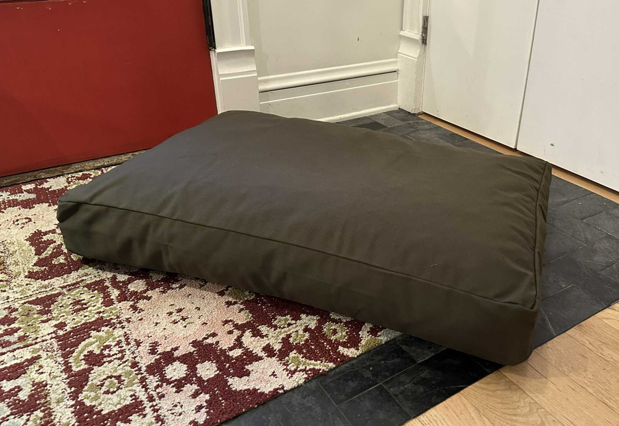 Heavy-duty cotton duck dog bed with CertiPUR foam fill and washable zippered cover