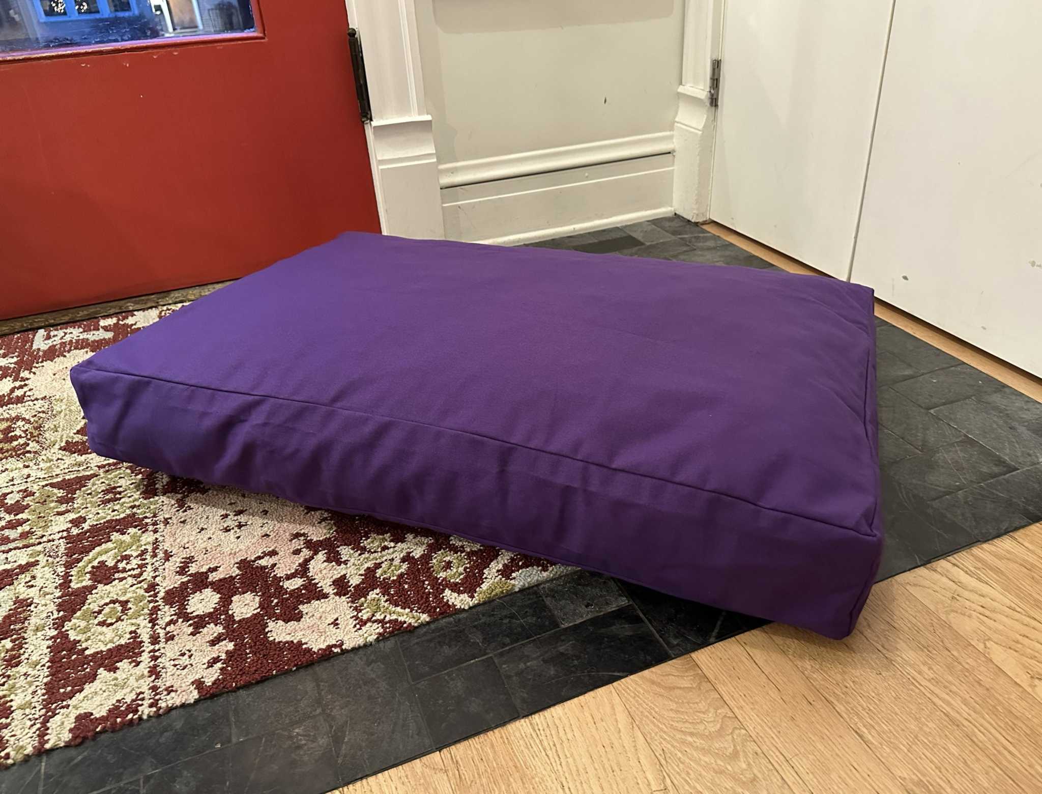Heavy-duty cotton duck dog bed with CertiPUR foam fill and zippered washable cover