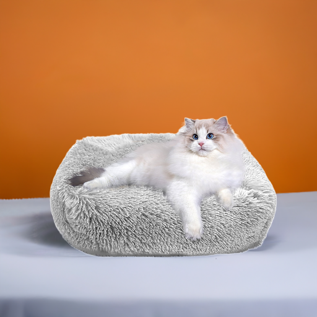 Light gray plush cat bed for indoor cats and small dogs up to 25 lbs with non-slip waterproof bottom