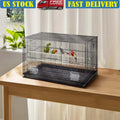 Large metal bird cage with perches and feeding boxes for cockatiels and parakeets